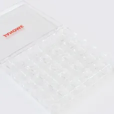 25 kusů průhledných cívek Janome v boxu